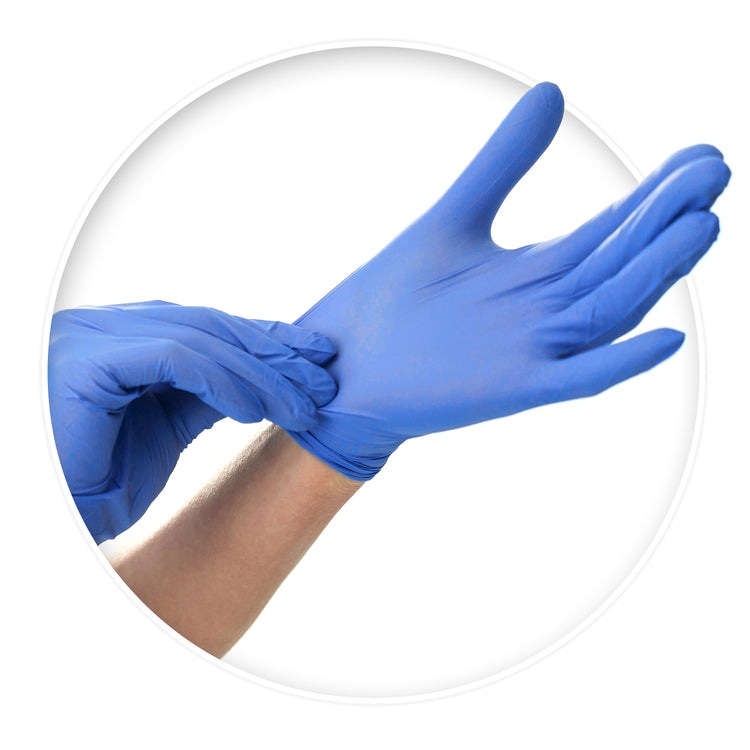 A pair of hands demonstrating the process of putting on blue disposable nitrile medical gloves against a white background.