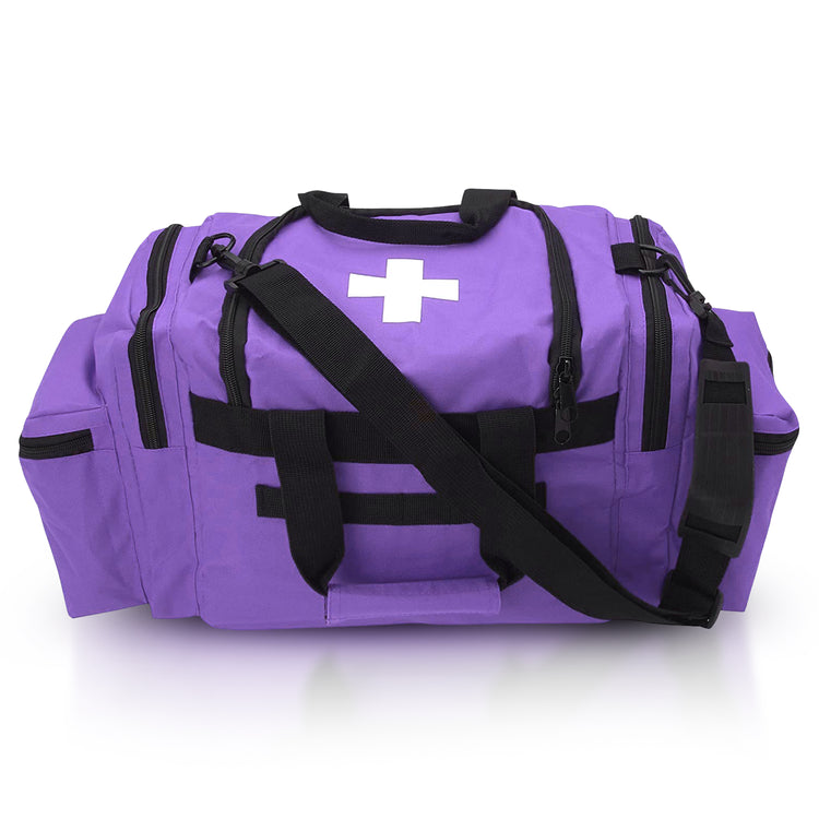 A studio shot of a bright purple medical trauma bag with black accents. The bag features a white medical cross on the top flap, a shoulder strap, sturdy carry handles, and multiple zippered compartments on the front and sides.