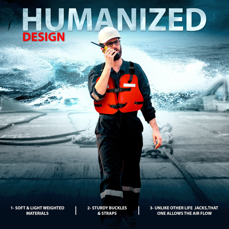 A man wearing dark blue work overalls, a white hard hat, and an orange life vest (personal flotation device) stands on the deck of a ship with turbulent waves in the background, speaking into a radio. Text describes the "HUMANIZED DESIGN" with features: "1- SOFT & LIGHT WEIGHTED MATERIALS," "2- STURDY BUCKLES & STRAPS," and "3- UNLIKE OTHER LIFE JACKS, THAT ONE ALLOWS THE AIR FLOW."