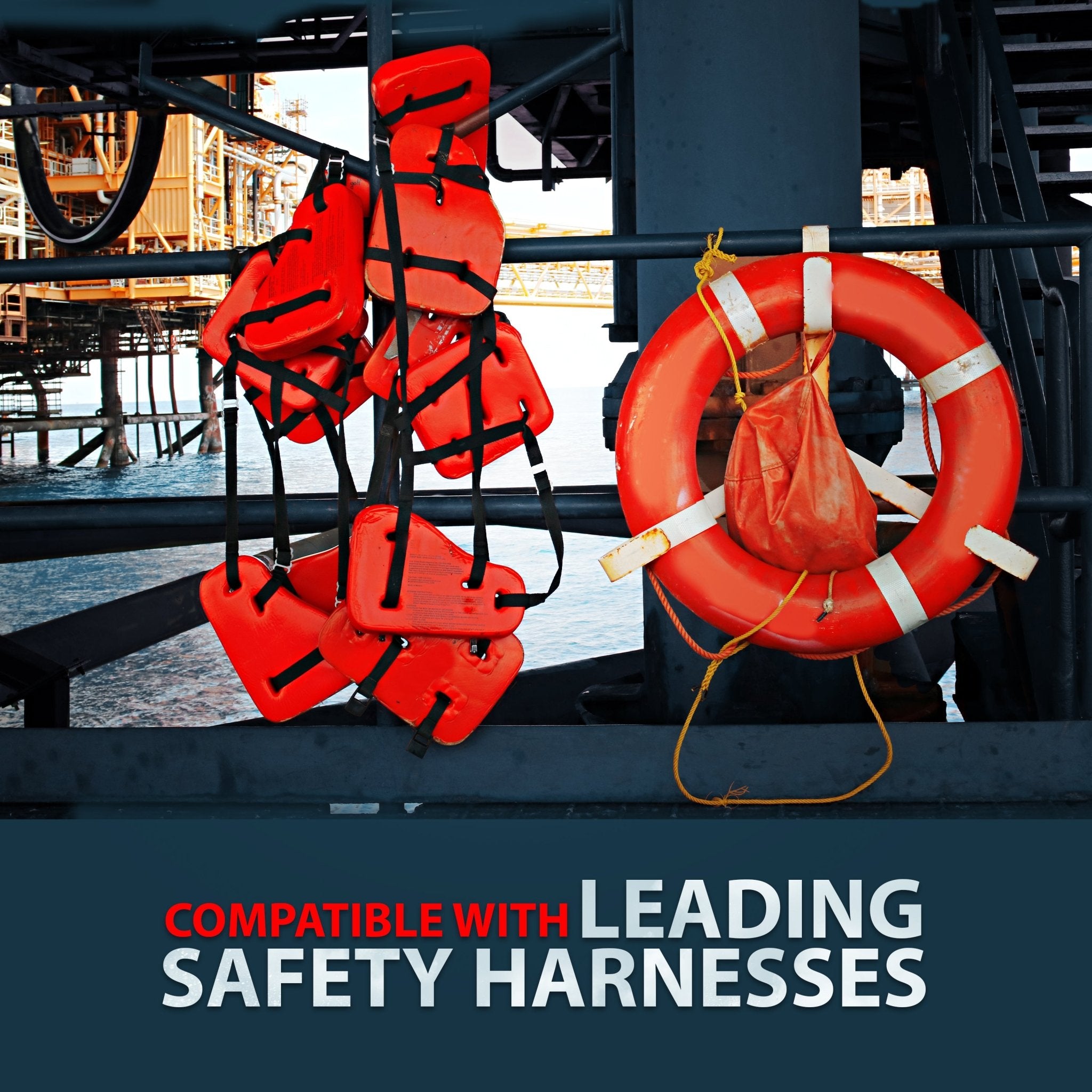 A photo taken on an offshore platform showing multiple orange life vests/jackets hung from a railing, next to a red and white life preserver ring. Text reads: "COMPATIBLE WITH LEADING SAFETY HARNESSES."