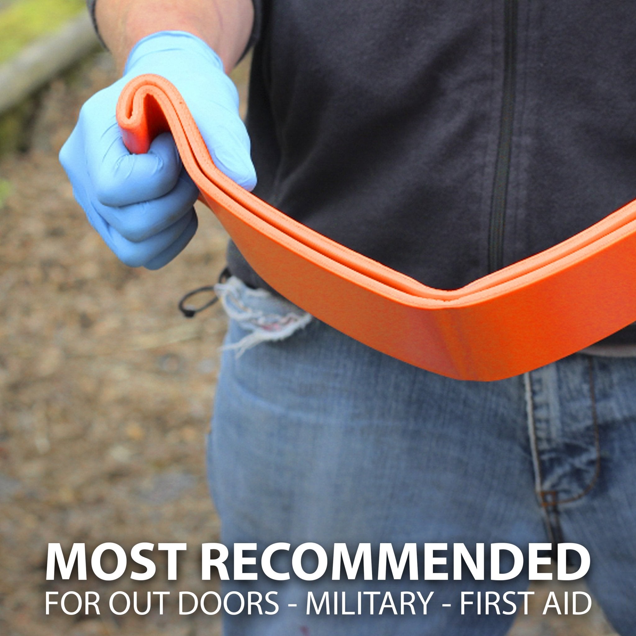 A person wearing a blue glove is holding and bending a wide, flat strip of the orange splint material, showing its flexibility. Text overlay reads: MOST RECOMMENDED FOR OUT DOORS - MILITARY - FIRST AID.