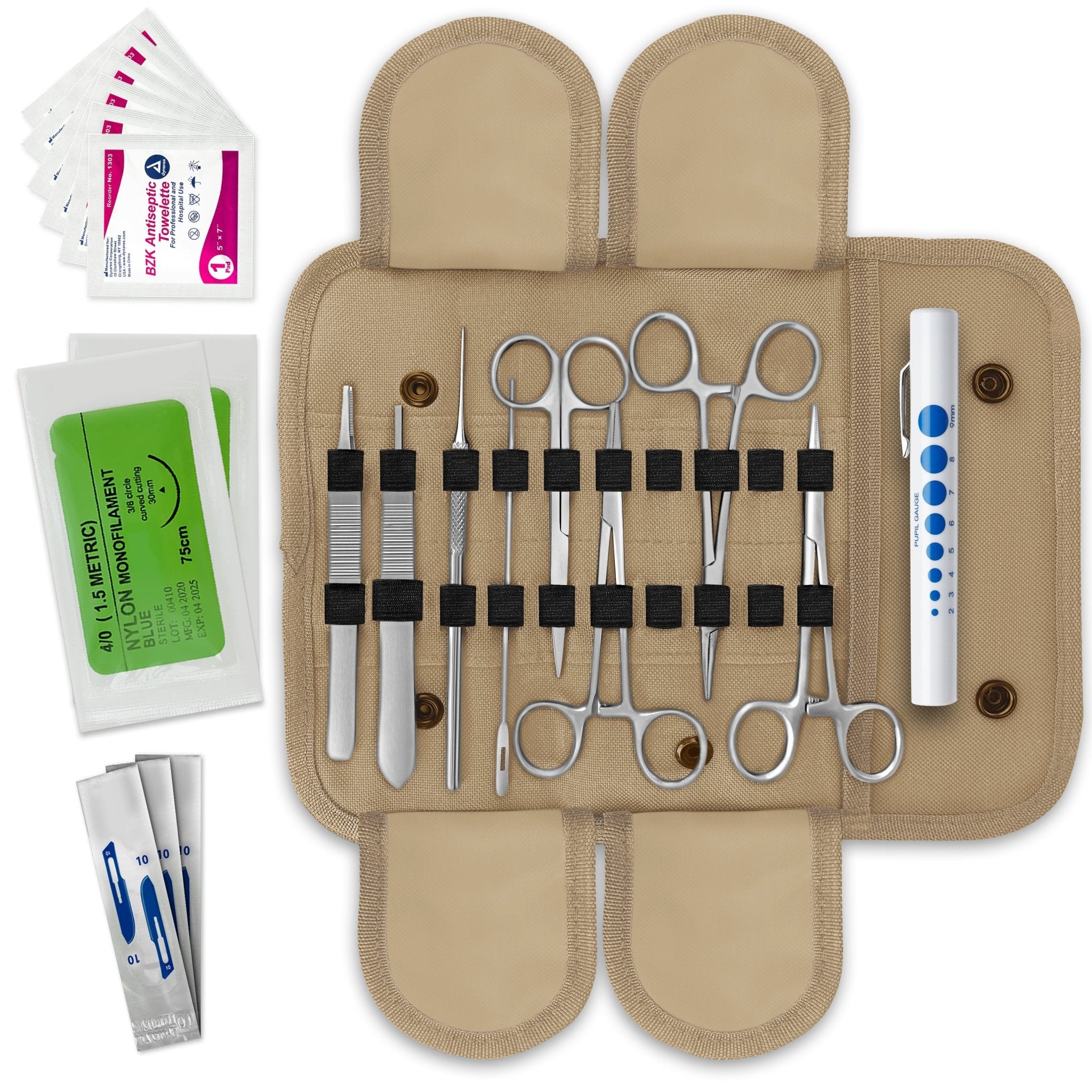 A flat-lay view of an open military-style medical kit. A beige canvas pouch with elastic loops holds various stainless steel tools including hemostats, scissors, forceps, a probe, a scalpel handle, and a pen light. Sterile suture packets and antiseptic wipes are placed to the side.