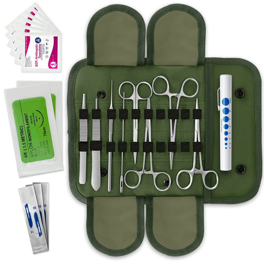 A flat-lay view of an open military-style medical kit. A green canvas pouch with elastic loops holds various stainless steel tools including hemostats, scissors, forceps, a probe, a scalpel handle, and a pen light. Sterile suture packets and antiseptic wipes are placed to the side.