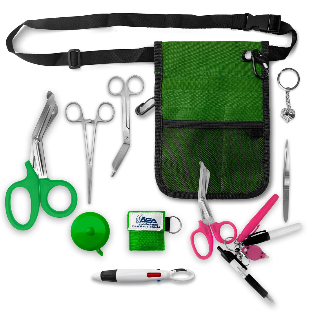 A top-down view displaying all items included in the kit laid out separately: the green organizer pouch, adjustable black belt, large green trauma shears, smaller bandage scissors, straight hemostats, green tape measure, CPR face shield keychain, tweezers, a 4-color carabiner pen, permanent markers, and a rhinestone heart charm.