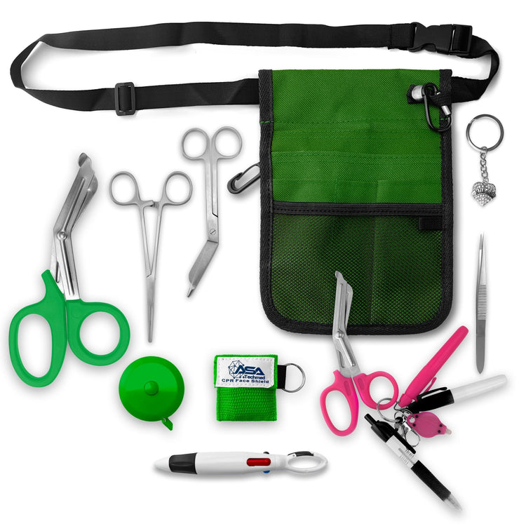 A top-down view displaying all items included in the kit laid out separately: the green organizer pouch, adjustable black belt, large green trauma shears, smaller bandage scissors, straight hemostats, green tape measure, CPR face shield keychain, tweezers, a 4-color carabiner pen, permanent markers, and a rhinestone heart charm.
