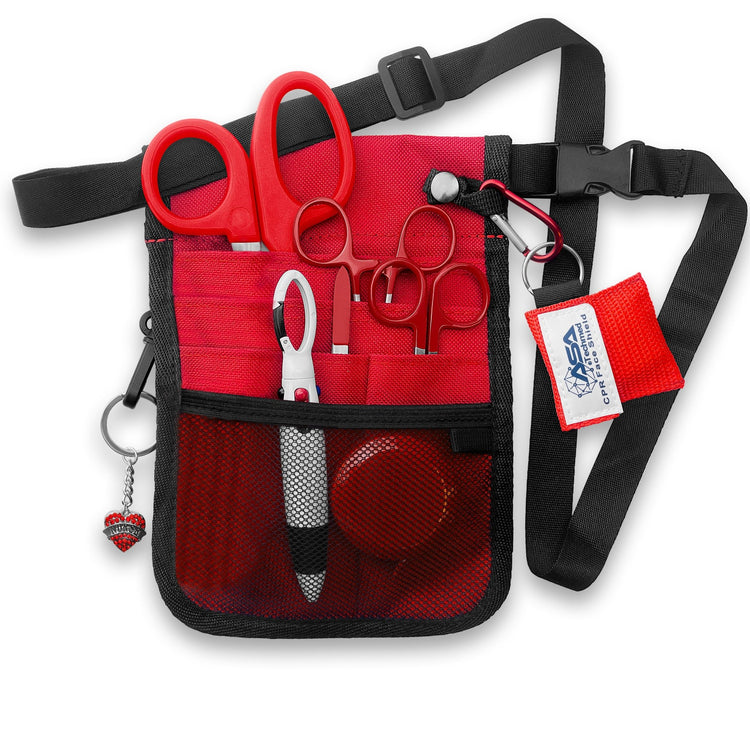 The red nurse organizer shown fully packed with all the included tools. The shears, scissors, and hemostats are tucked into the slip pockets, while the tape measure and pens sit in the mesh pocket. The CPR face shield and heart charm are clipped to the exterior rings, demonstrating how the kit looks when ready for use.
