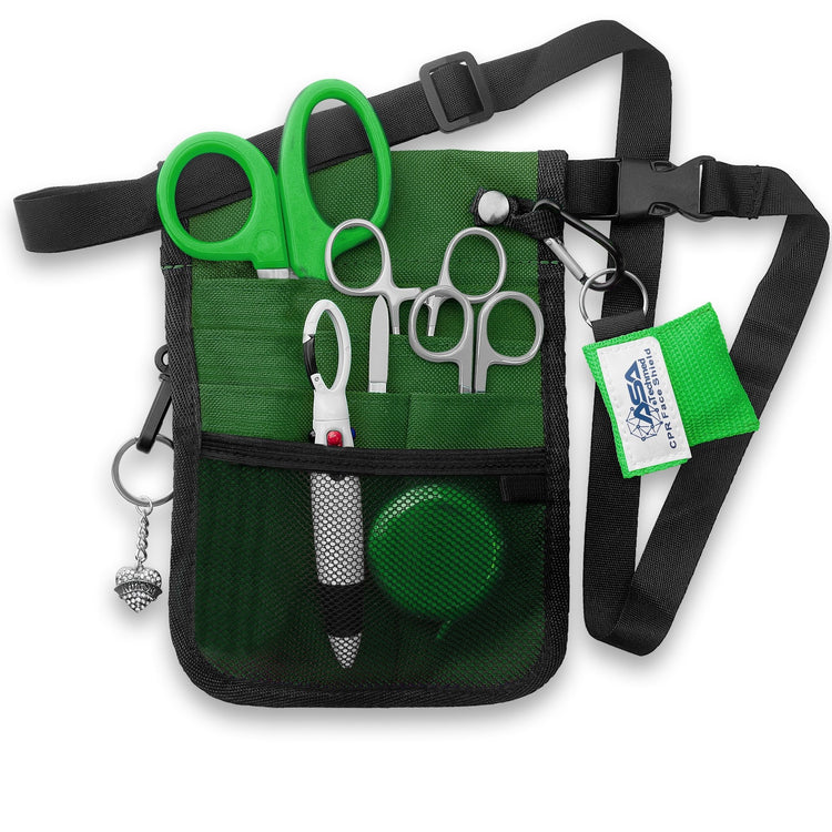 The green nurse organizer shown fully packed with all the included tools. The shears, scissors, and hemostats are tucked into the slip pockets, while the tape measure and pens sit in the mesh pocket. The CPR face shield and heart charm are clipped to the exterior rings, demonstrating how the kit looks when ready for use.