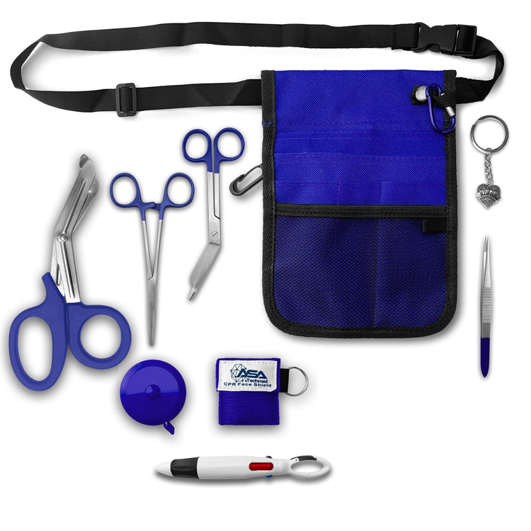 A top-down view of the complete nursing kit contents spread out. Items include the blue waist organizer with black belt, blue-handled trauma shears, stainless steel bandage scissors, straight hemostat forceps, a blue round retractable tape measure, a blue square CPR face shield keychain, metal tweezers, a multi-color pen, permanent markers on a clip, and a rhinestone heart charm reading "Nurse".