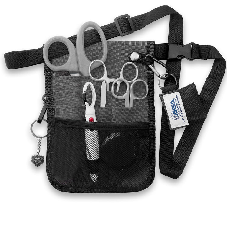 The gray nurse organizer shown fully packed with all the included tools. The shears, scissors, and hemostats are tucked into the slip pockets, while the tape measure and pens sit in the mesh pocket. The CPR face shield and heart charm are clipped to the exterior rings, demonstrating how the kit looks when ready for use.