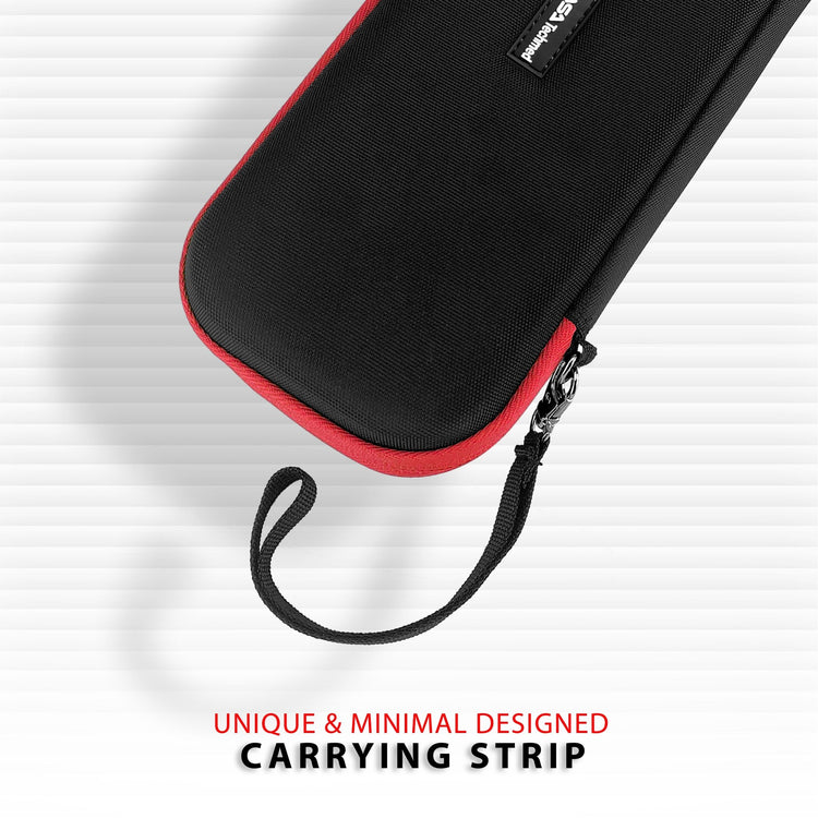 A close-up graphic of the corner of the black hard-shell case with red trim, focusing on the "unique and minimal designed carrying strip" attached to the zipper area.