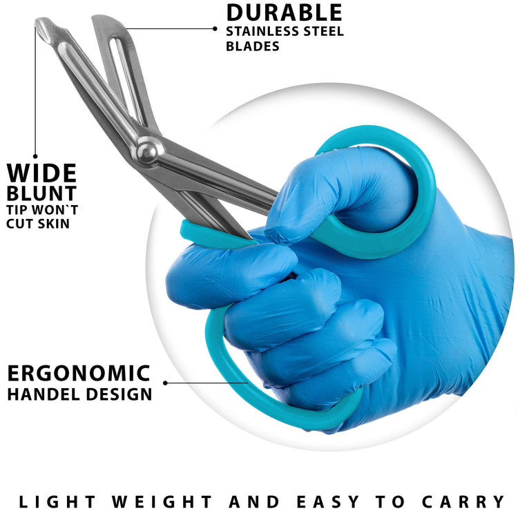 A gloved hand holding teal heavy-duty trauma shears, emphasizing the ergonomic handle and wide blunt tip designed to prevent skin injury.