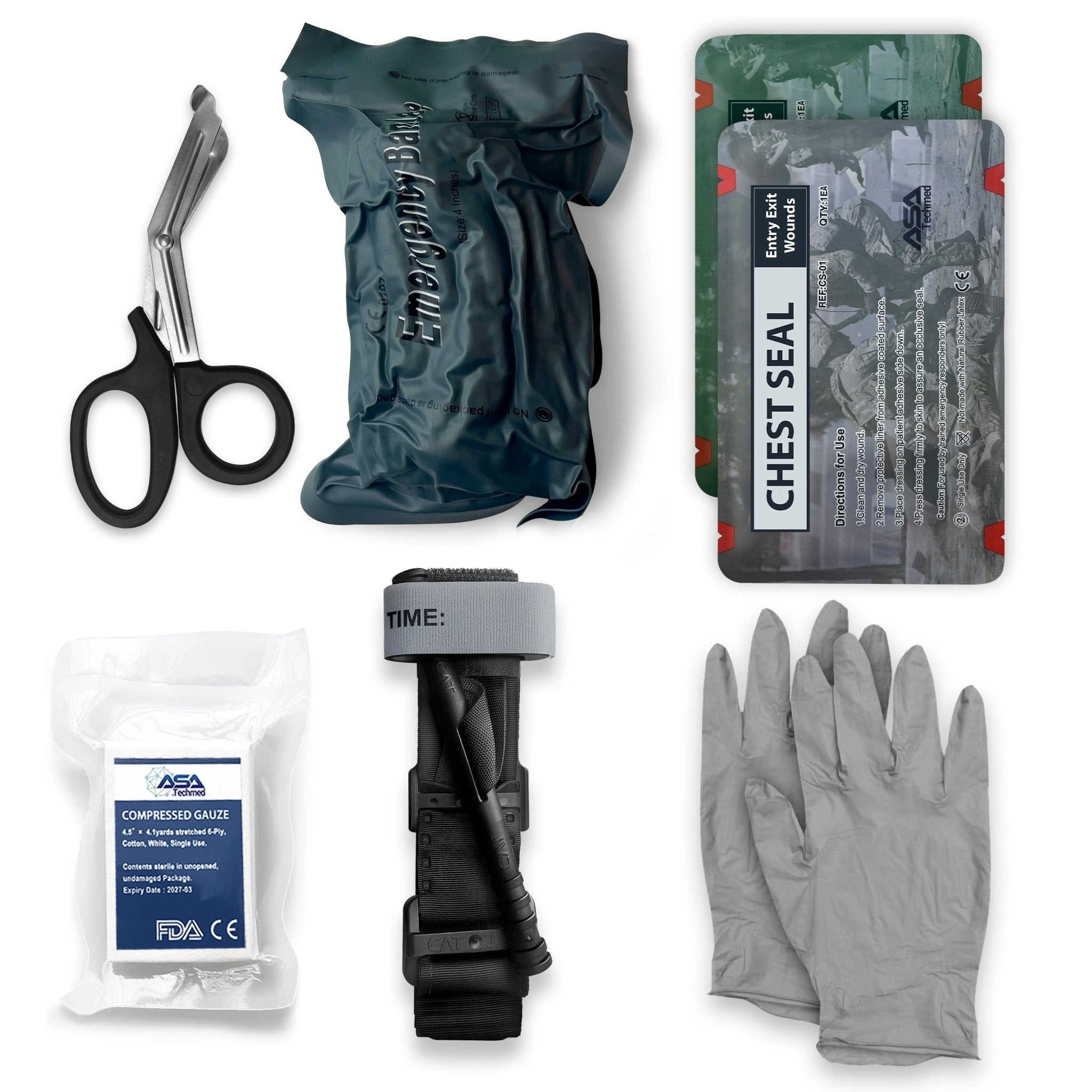 A flat lay of emergency medical supplies including black trauma shears, a packaged emergency bandage, two chest seal packages, compressed gauze, a CAT tourniquet, and a pair of grey gloves.