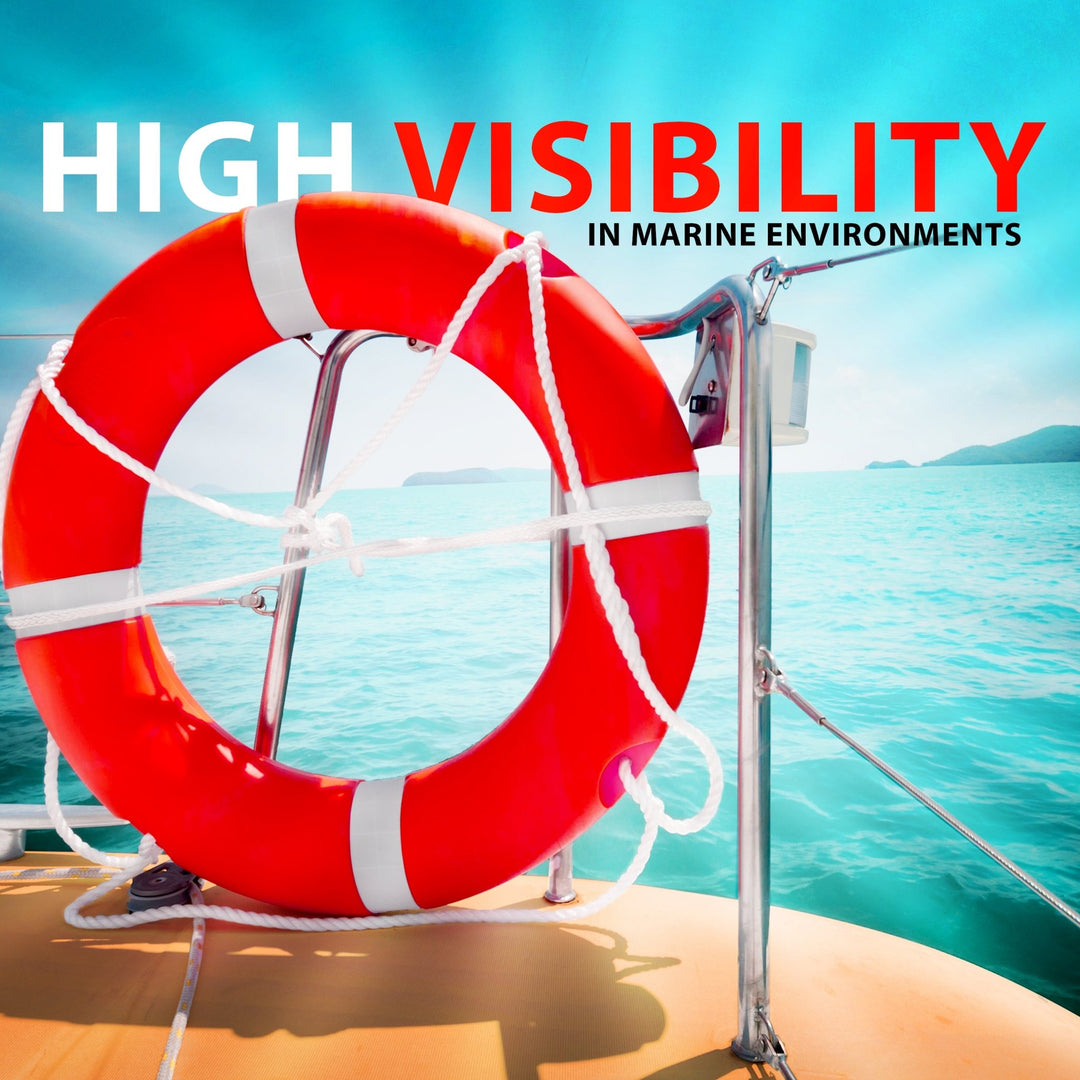 An orange life ring mounted on the silver railing of a boat with a bright, sunny ocean background. Text overlay reads: "High Visibility in Marine Environments."