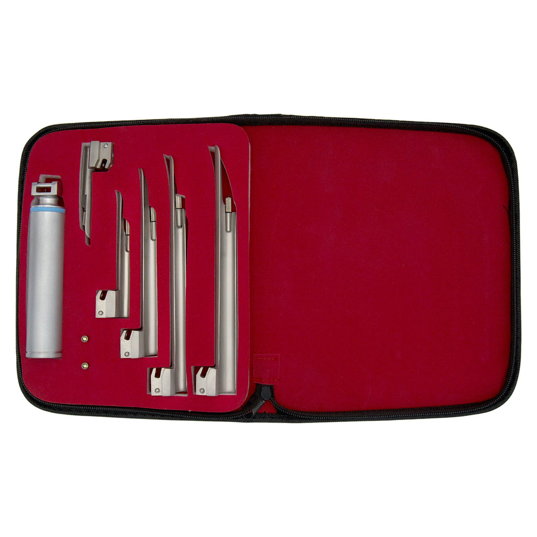 An open medical instrument case with a red interior lining, neatly displaying a silver laryngoscope handle, five straight Miller blades of different lengths, and two spare light bulbs secured in designated slots.