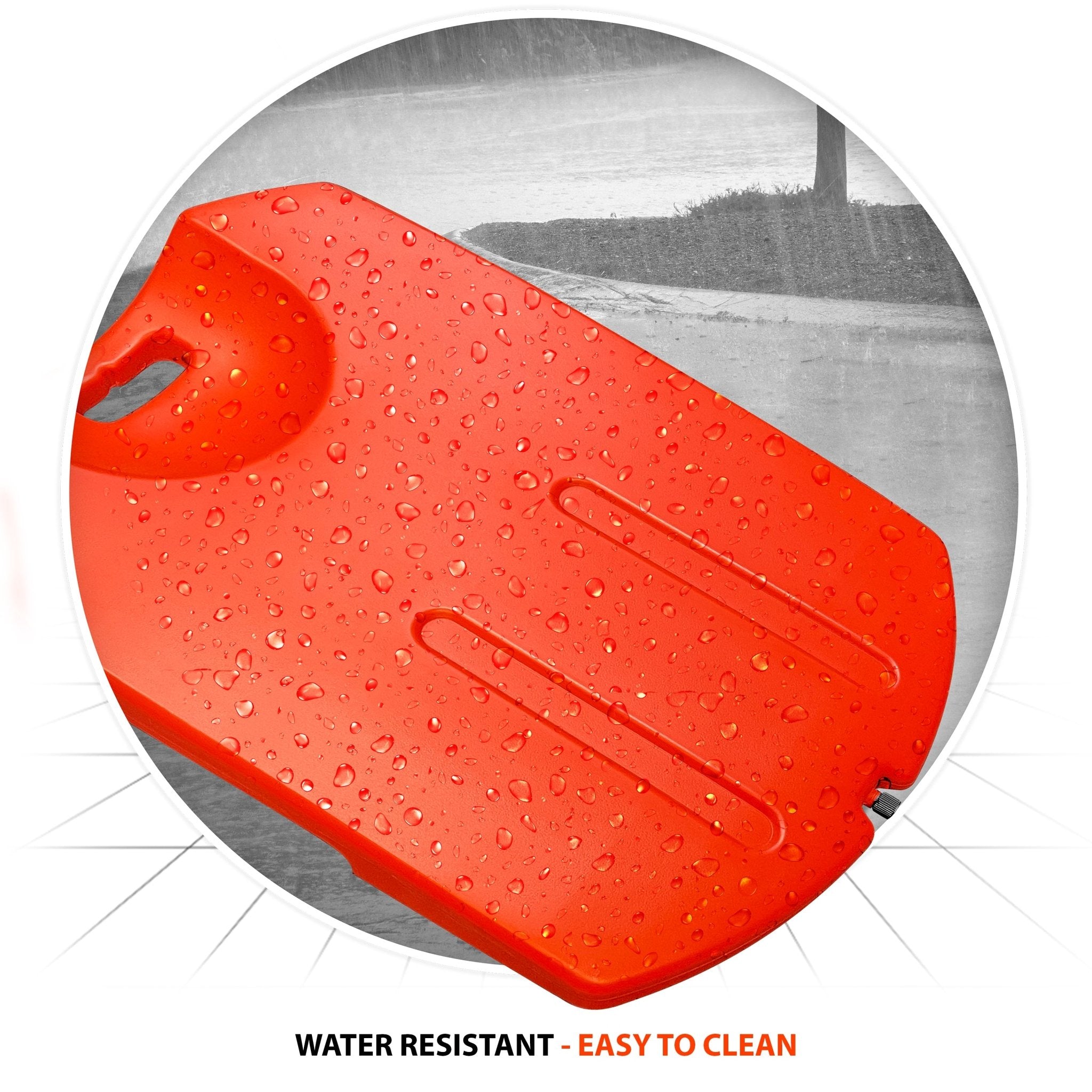 A close-up of the red CPR board covered in water droplets against a gray rainy background, with text highlighting that it is "Water resistant - Easy to clean".