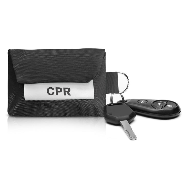 A black CPR pouch attached to a car key fob and ignition key via its metal ring, showing its utility as a keychain.