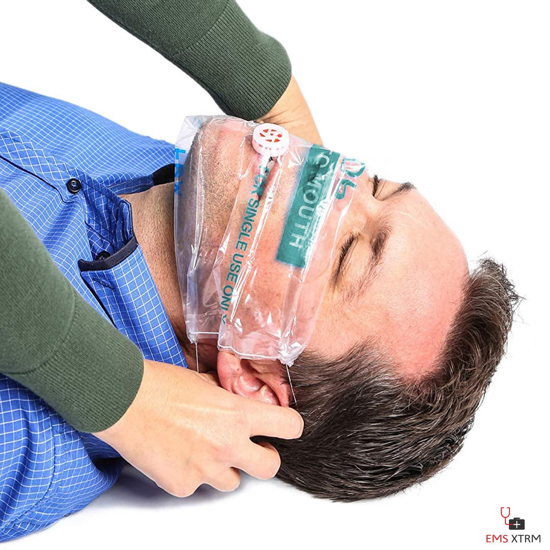 A close-up view of a person with a clear CPR face shield secured over their mouth and nose, highlighting the one-way valve and usage instructions.