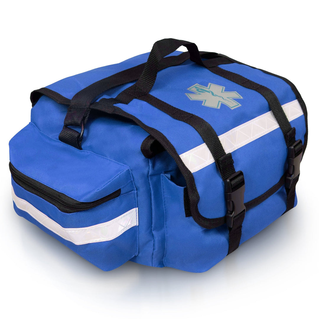 An angled side view of the blue first responder bag, highlighting one of the large zippered side pockets. The image details the silver reflective safety strip running across the pocket and the sturdy black webbing of the carrying handles.