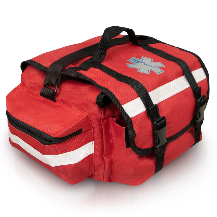An angled side view of the red first responder bag, highlighting one of the large zippered side pockets. The image details the silver reflective safety strip running across the pocket and the sturdy black webbing of the carrying handles.