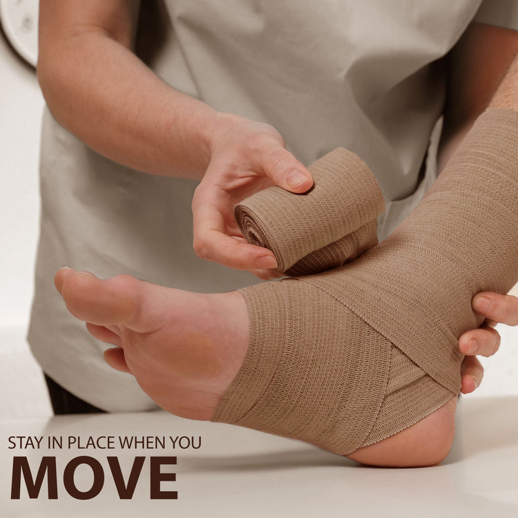Hands applying a beige elastic bandage to a foot and ankle. Text reads: Stay in place when you move.