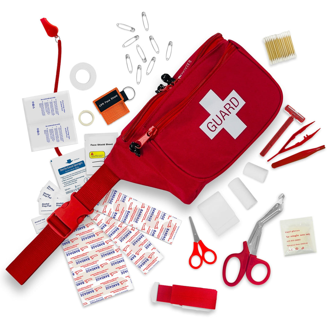 Red "GUARD" fanny pack with first aid supplies spilling out, including bandages, shears, tweezers, alcohol pads, and a CPR keychain.