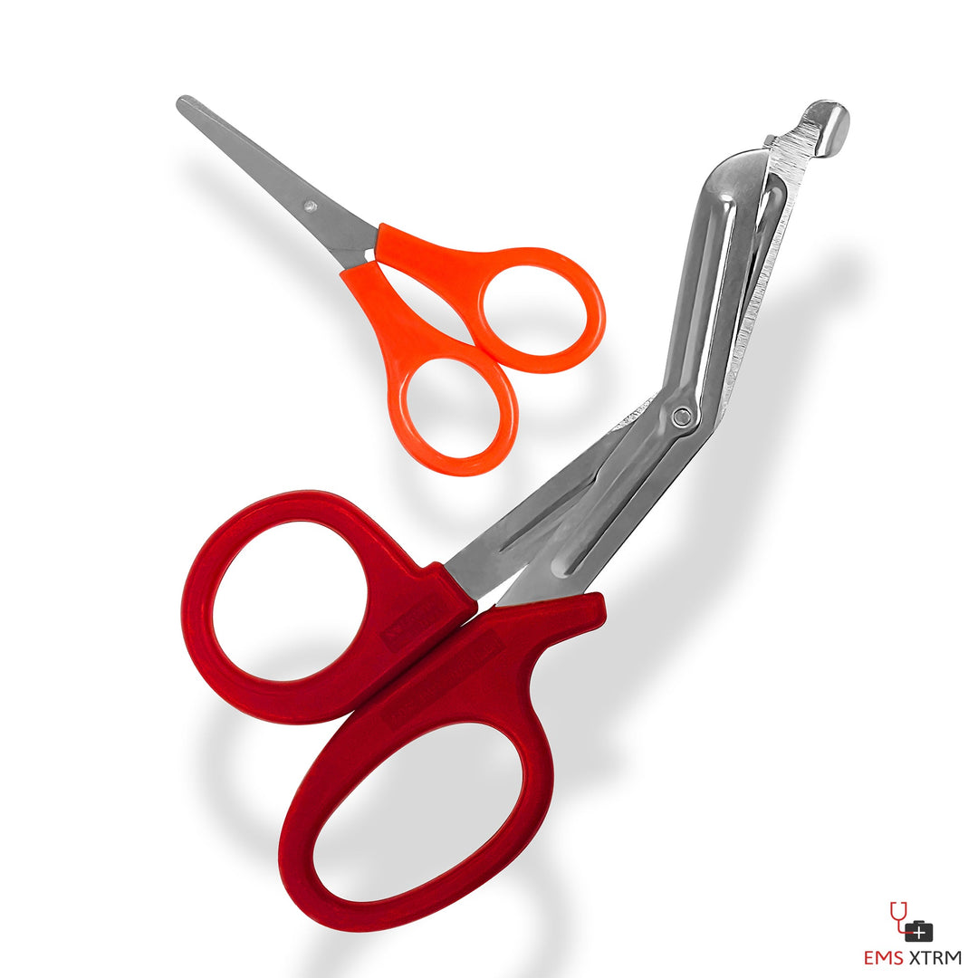 Pair of scissors: small orange-handled scissors and large red-handled EMT trauma shears.