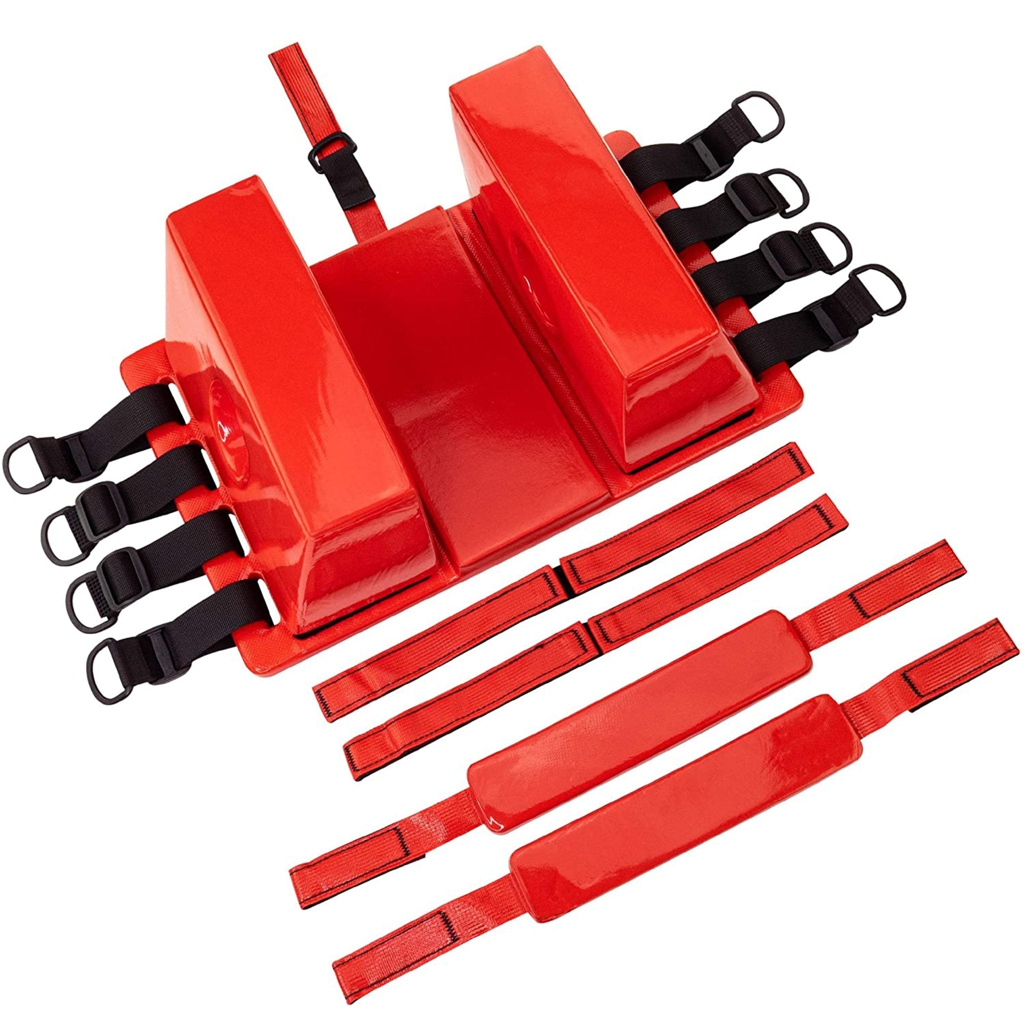 Top-down view of the complete red head immobilizer kit, including base plate, two head blocks, and two forehead/chin straps.
