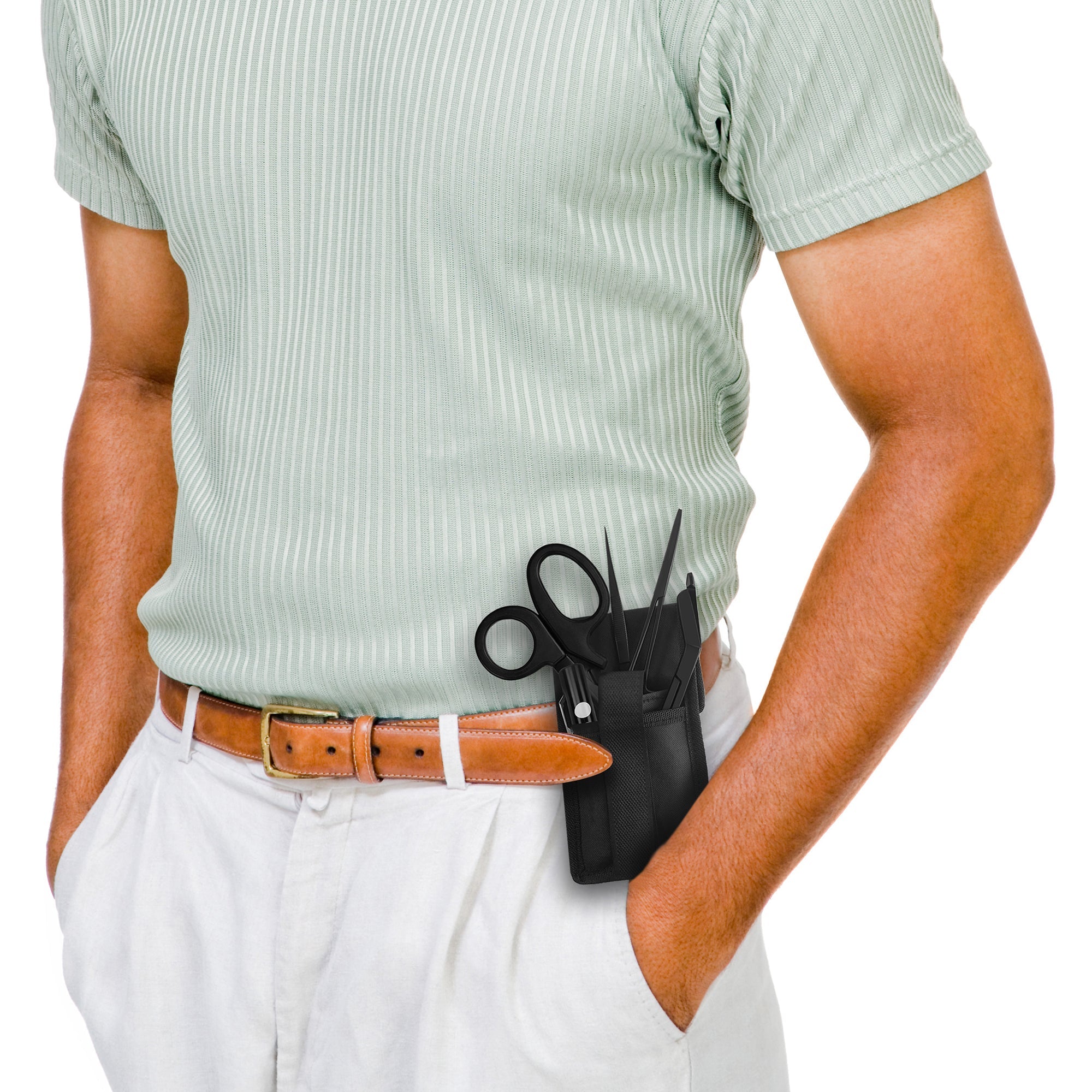 A person wearing a light green shirt and white pants with a black medical tool pouch clipped to their belt.