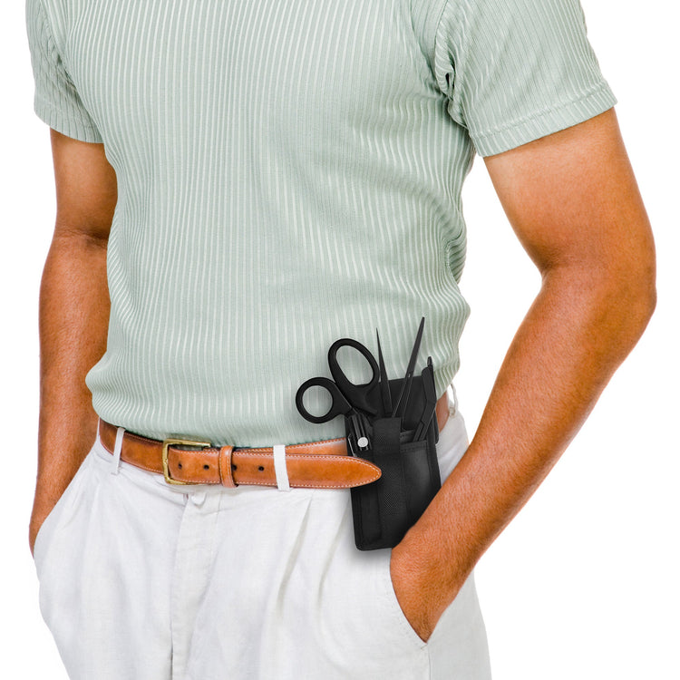 A person wearing a light green shirt and white pants with a black medical tool pouch clipped to their belt.