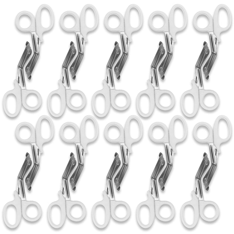 A pattern created by ten pairs of white trauma shears arranged in two rows against a white background. The shears are identical, with white plastic handles and stainless steel blades.