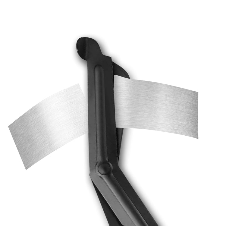 Black trauma shears shown cutting through a strip of silver metallic material.