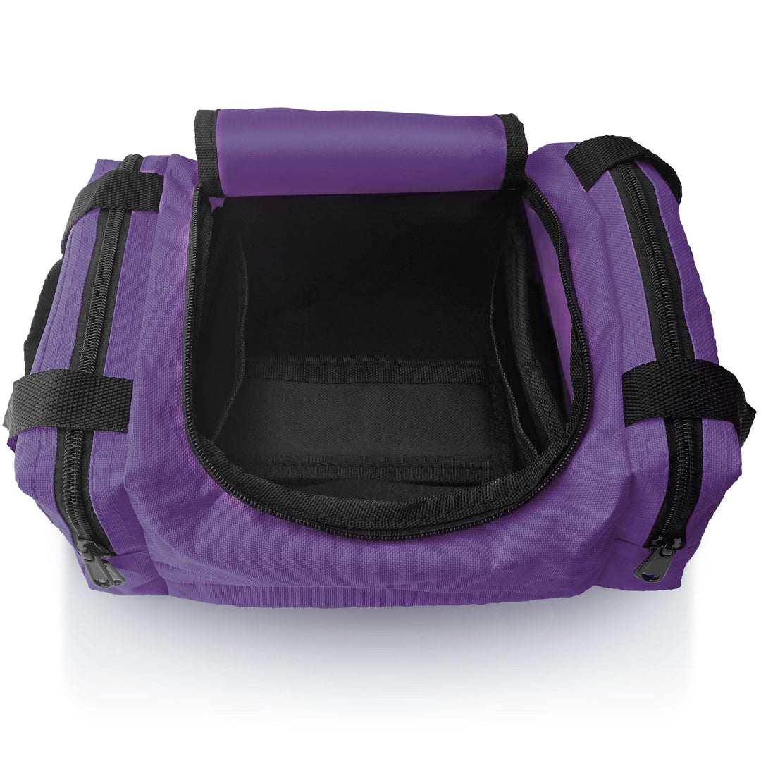 An overhead view of an empty, open purple first aid bag, revealing the black interior lining of the main compartment and the layout for storing medical supplies.