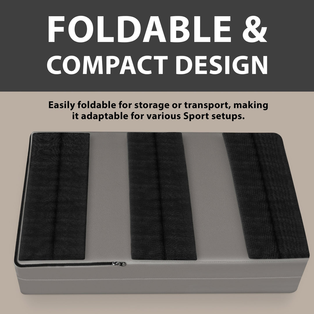 A gray wall pad shown folded flat on the ground, displaying the back side with three wide black hook-and-loop strips for mounting, with text highlighting the "FOLDABLE & COMPACT DESIGN".