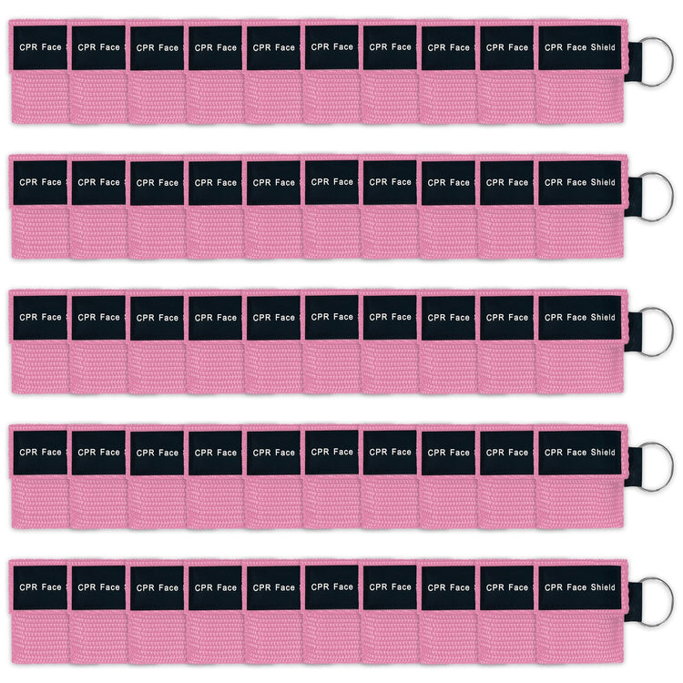 A bulk package display of fifty pink CPR face shield keychains arranged neatly in five rows of ten, suitable for training or large groups.