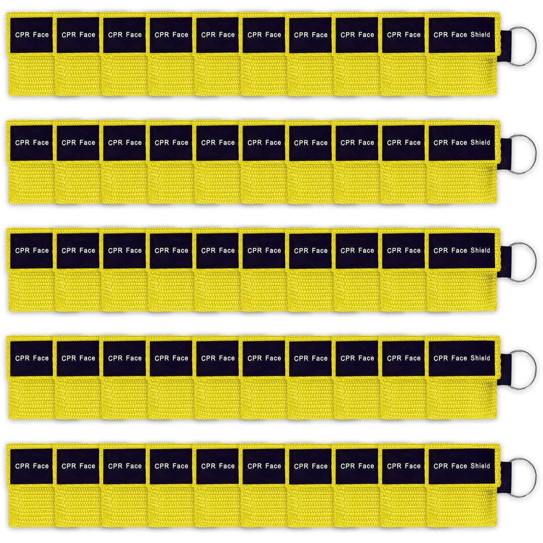 A bulk package display of fifty yellow CPR face shield keychains arranged neatly in five rows of ten, suitable for training or large groups.
