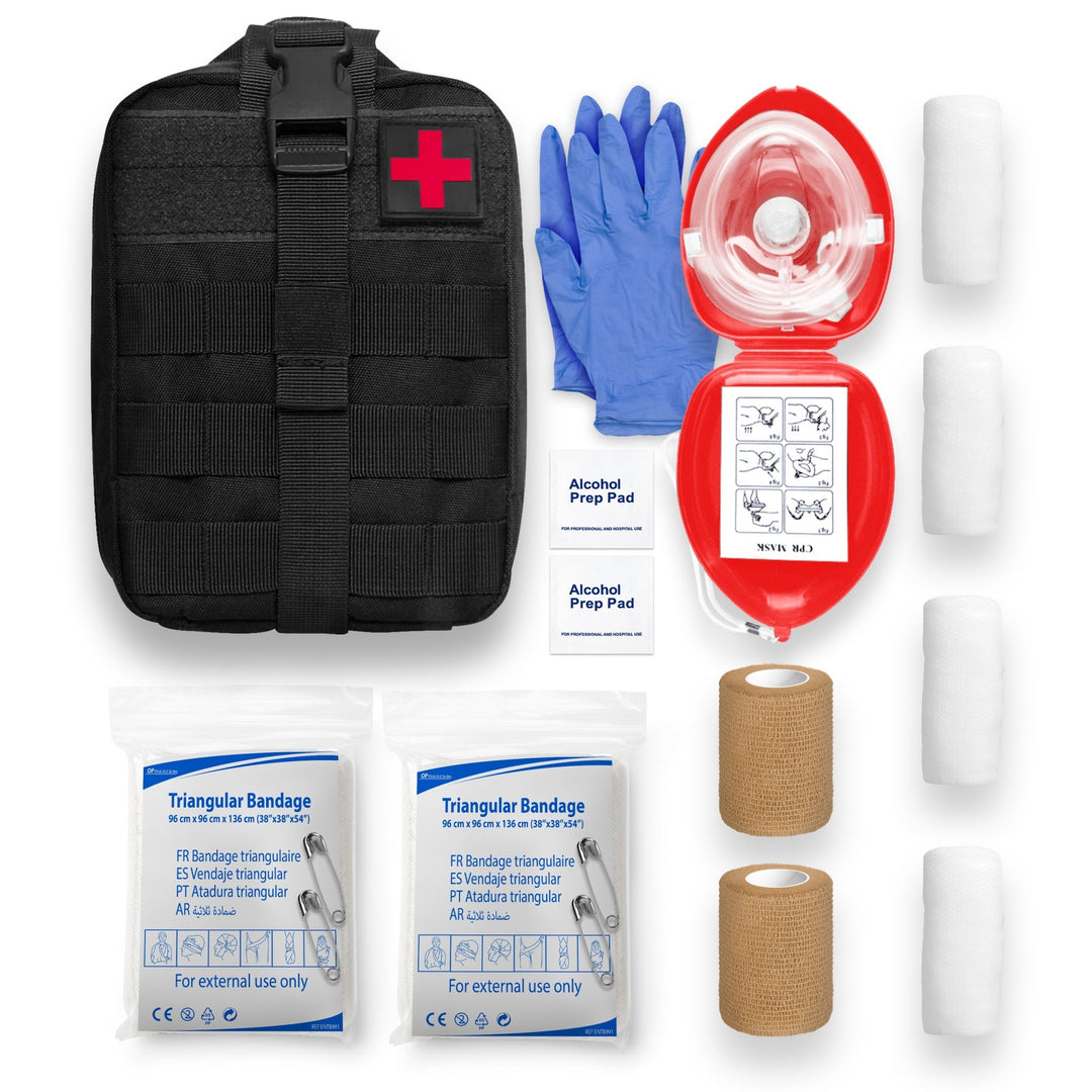 A flat-lay inventory of the emergency kit contents. It includes one black tactical pouch with a red cross, a pair of blue gloves, a red CPR mask case, two alcohol prep pads, two packaged triangular bandages, two rolls of tan self-adhesive wrap, and three rolls of white gauze bandage.
