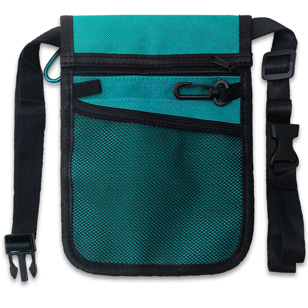 The reverse side view of the teal medical pouch. This side features a large zippered compartment at the top, a mesh slip pocket below it, and a black plastic key clip. The durable black nylon waist strap is fully visible on both sides.