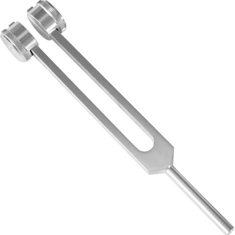 A high-resolution top-down view of a single silver aluminum C128 tuning fork. The image clearly shows the two parallel prongs, the circular weights at the ends, and the long, slender handle used for gripping.