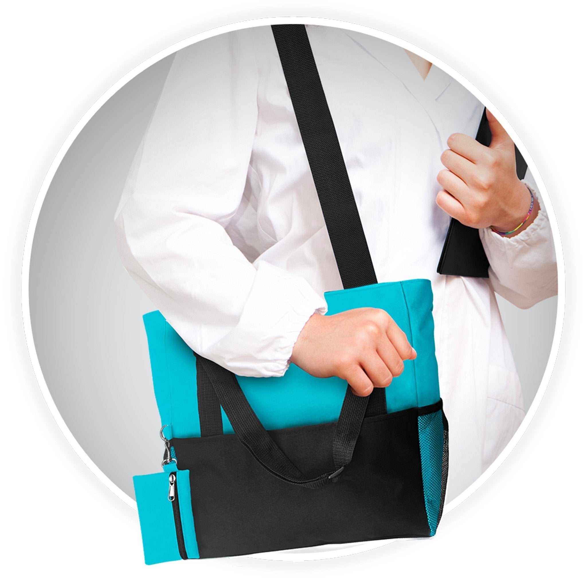 A medical professional in a white coat carrying the teal and black nursing tote bag over their shoulder while holding a folder.