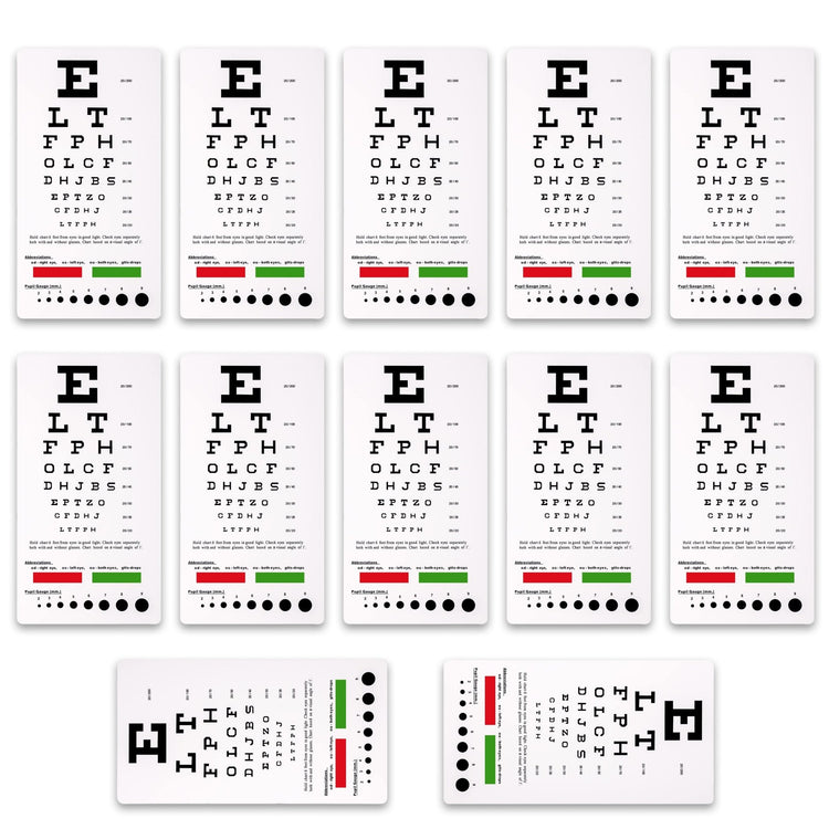 A set of twelve identical plastic Snellen pocket eye charts arranged in a grid, featuring standard vision testing letters, color bars, and pupil gauge markings