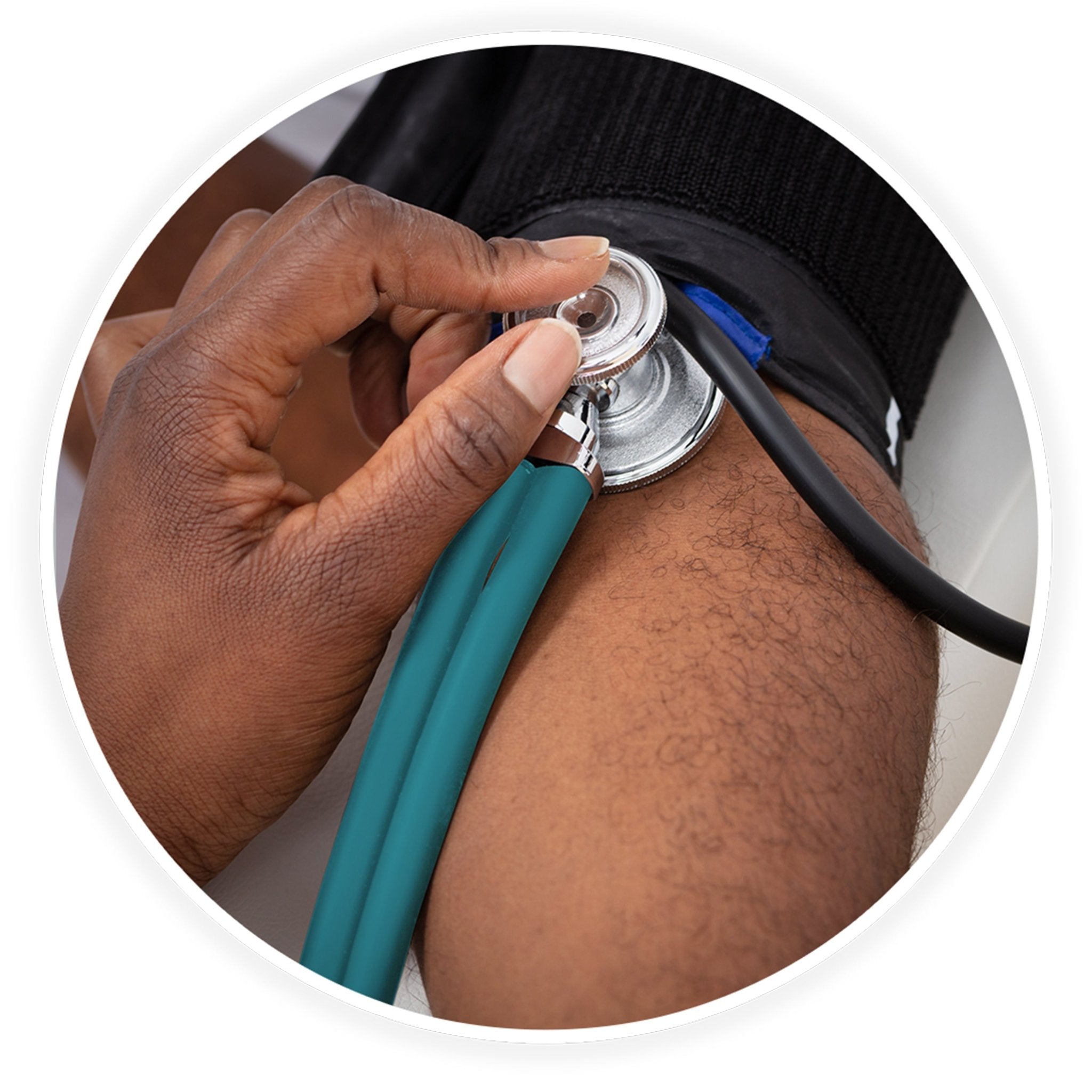 A close-up photo demonstrating a medical examination. A dark-skinned healthcare professional's hand is shown using the teal stethoscope to check a patient's blood pressure, placing the chest piece against the arm just below a black blood pressure cuff.