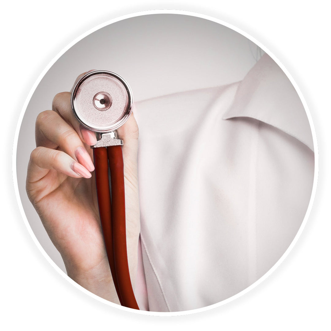 A close-up shot of a medical professional, likely a doctor or nurse wearing a white coat, holding the chest piece of a burgundy stethoscope. The focus is on the stainless steel dual-head bell and the hand gripping it, emphasizing the instrument's professional appearance.