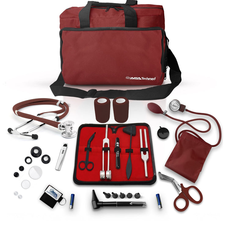 A complete burgundy medical equipment kit laid out flat, featuring a large trauma bag surrounded by essential tools including a stethoscope, BP cuff, otoscope, tuning forks, and first aid supplies.