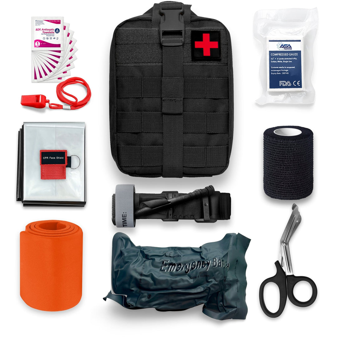A complete flat-lay overview of the black tactical trauma kit arranged on a white background. Central to the image is the black MOLLE pouch with a red cross patch. Surrounding it are the contents: an orange rolled splint, a silver emergency blanket, a red whistle, a red CPR mask pouch, a fan of antiseptic wipes, a package of compressed gauze, a roll of black self-adherent wrap, a black tourniquet, stainless steel shears, and a vacuum-sealed emergency bandage.