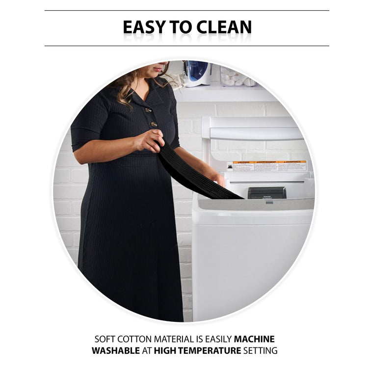 An instructional lifestyle image titled "EASY TO CLEAN." A woman is shown standing in a laundry room, placing the black gait belt into a white top-loading washing machine. Text at the bottom highlights the care instructions: "SOFT COTTON MATERIAL IS EASILY MACHINE WASHABLE AT HIGH TEMPERATURE SETTING."