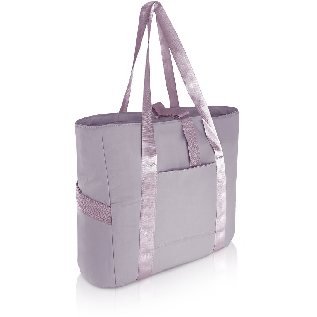A 3/4 angle studio shot of the empty purple tote bag against a white background. The image displays the dual shoulder straps, the front slip pocket, and the side elastic pockets.