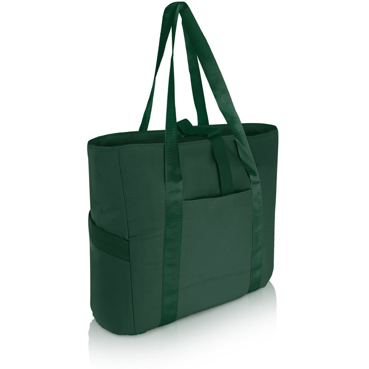 A 3/4 angle studio shot of the empty dark green tote bag against a white background. The image displays the dual shoulder straps, the front slip pocket, and the side elastic pockets.