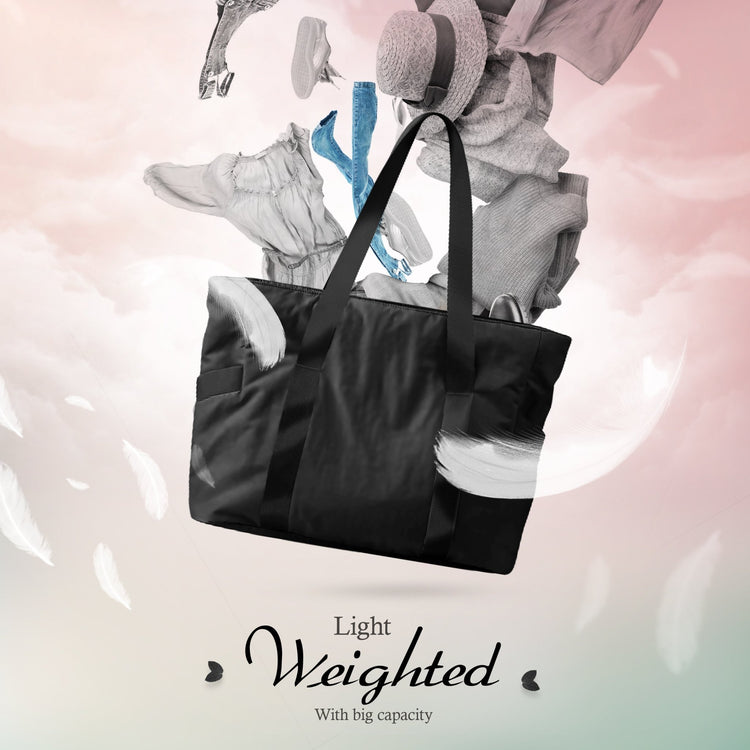 A creative composite image showing the black tote bag floating among clouds and white feathers. Various clothing items, including jeans, a hat, and a dress, appear to be floating out of the bag, illustrating its storage potential. Text reads, "Light Weighted With big capacity."